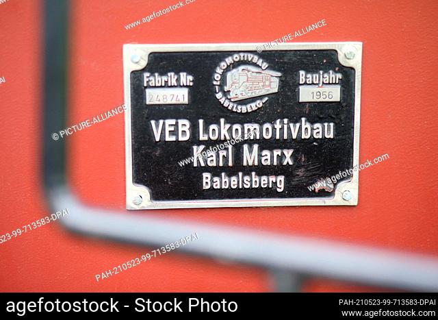 23 May 2021, Saxony-Anhalt, Schlanstedt: A manufacturer's plaque is attached to a historic light railway. In the light railway museum
