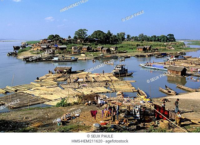 Myanmar Burma, Mandalay Division, nearby Mandalay, Burmese people live in precarious home on floating wood which they bring from the North to the delta of...