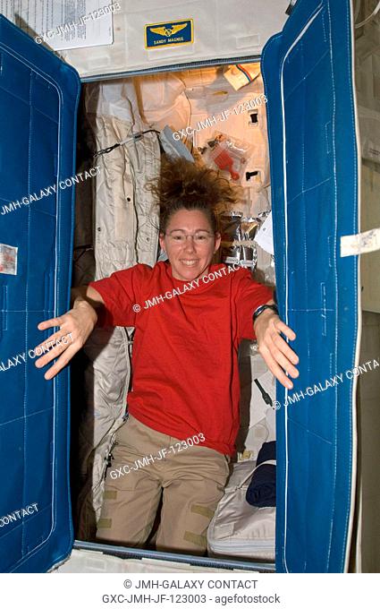Astronaut Sandra Magnus, Expedition 18 flight engineer, poses for a photo in her crew compartment in the Destiny laboratory of the International Space Station