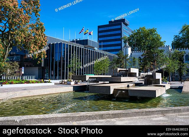Tilburg, North Brabant, The Netherlands, September 8, 2023 - Fountain and contemporary buildings at the town hall square