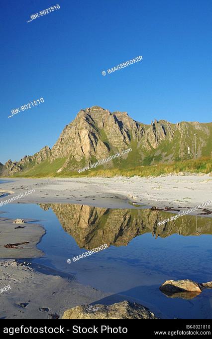 Mountains reflected in a small body of water, long, deserted sandy beach, Bleik, Andoya, Nordland, Norway, Europe