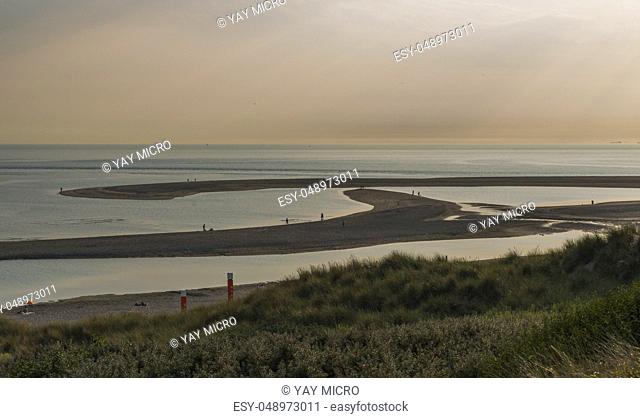 Rotterdam, Holland, 16-july-2018:People late at the day waiting for sunset at the Maasvlakte beach, at eight o clock it is still 28 deg celcius this year