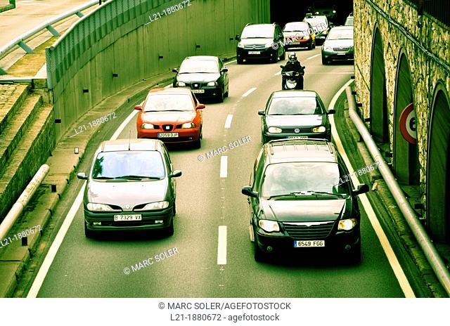 Cars move around the city. Ronda del Litoral, Barcelona, Catalonia, Spain