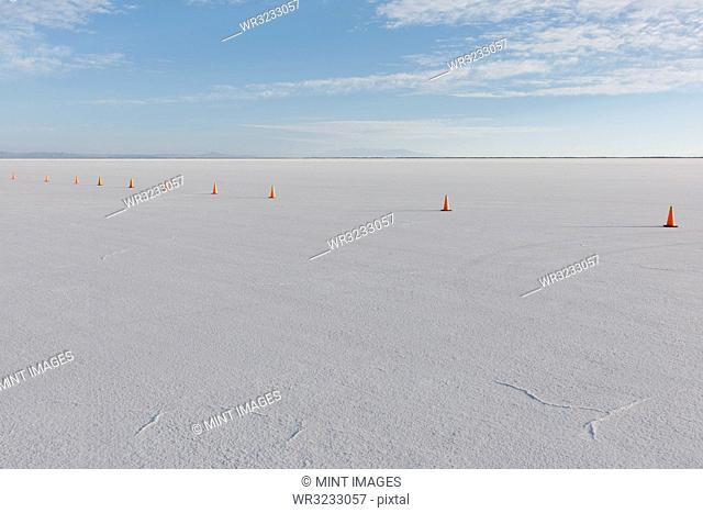 Traffic cones marking race course on Salt Flats at dusk