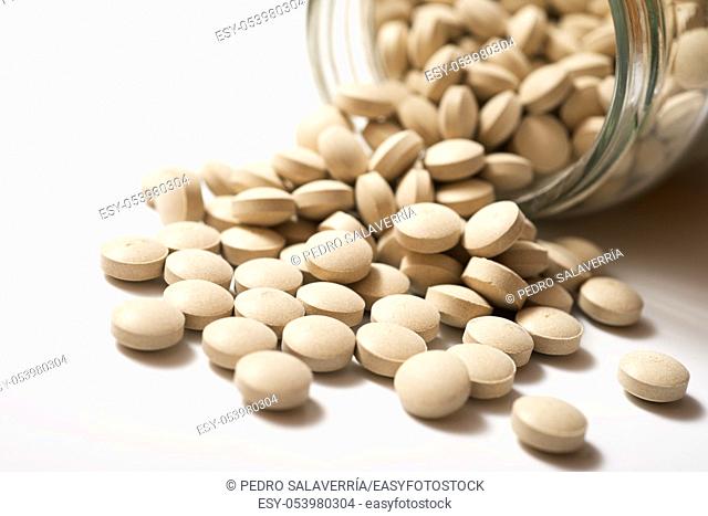 Beer yeast pills on a white table