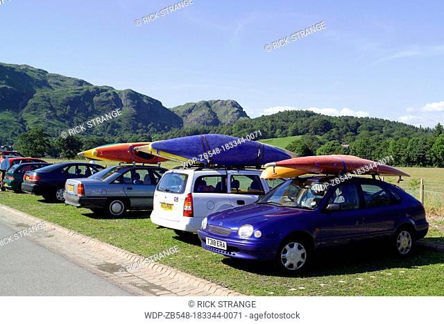 Canoes on cars, Coniston Jetty, Coniston Water, Lake District, Cumbria, UK