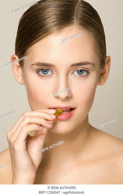Portrait of a girl eating sweets