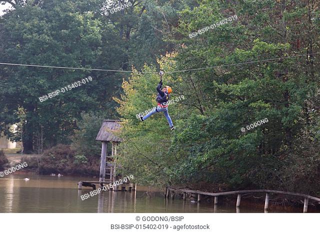 10-year-old boy on a rope course. France