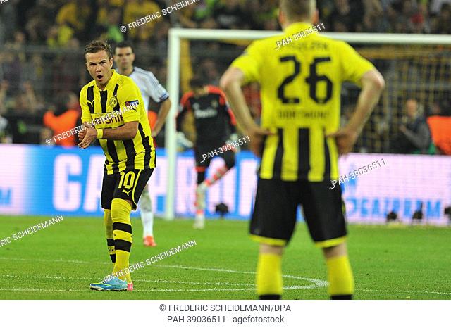 Dortmund's Mario Goetze (L) cheers his teammates on during the UEFA Champions League semi-final first leg soccer match between Borussia Dortmund and Real Madrid...