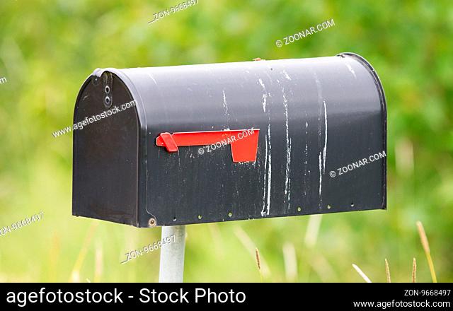 Rural mailbox on a metal post out on a country road