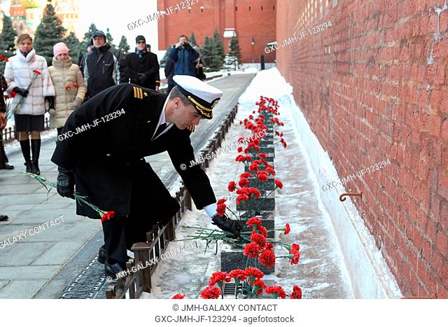 During a traditional tour of Red Square in Moscow March 7, Expedition 3536 Flight Engineer Chris Cassidy of NASA laid flowers at the Kremlin Wall where Russian...