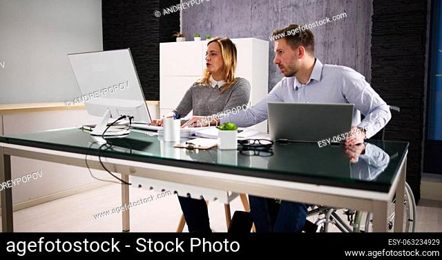 Two Analyst People Working On Computer In Office
