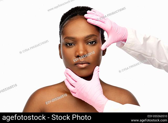 african american woman and hands in medical gloves