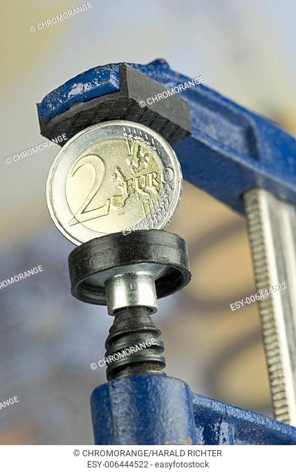 A Two Euro coin in a clamp