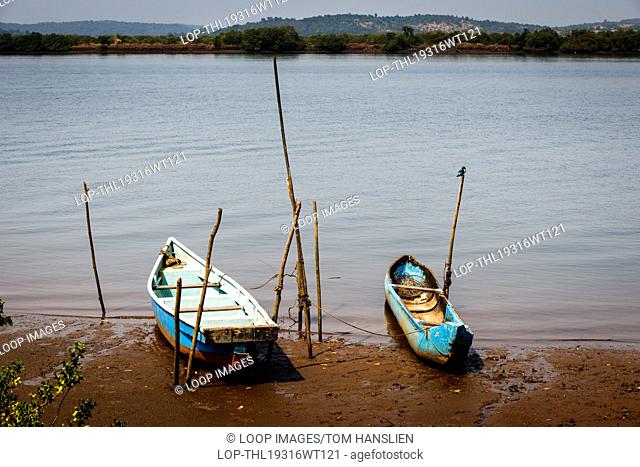 Boats on the shore of The Mandovi River in Goa
