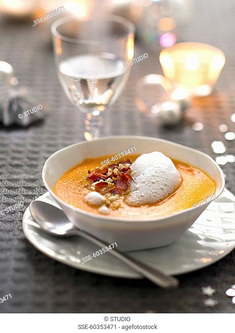 Cream of pumpkin soup with crisp bacon and maple syrup espuma
