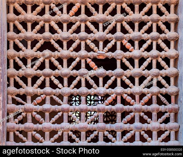 Old grunge weathered wooden fixed latticed window (Mashrabiya), Cairo, Egypt