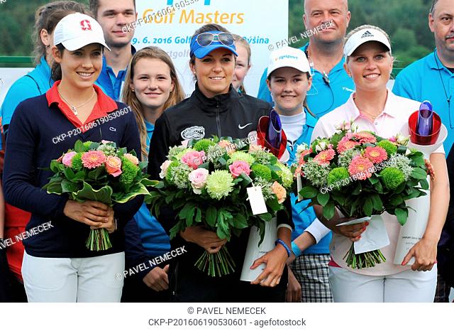 Golf players Albane Valenzuela of Switzerland (left), Czech Karolina Vlckova (centre) and winner Nanna Koerstz Madsen of Denmark (right) hold their trophies...