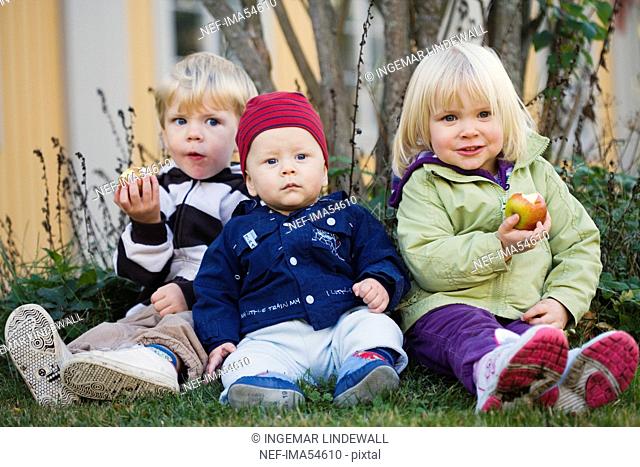 Three children eating fruits, Nacka, Sweden
