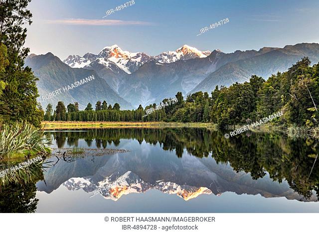 View of Mount Cook and Mount Tasman, reflection in Lake Matheson, Westland National Park, New Zealand Alps, West Coast Region, South Island, New Zealand
