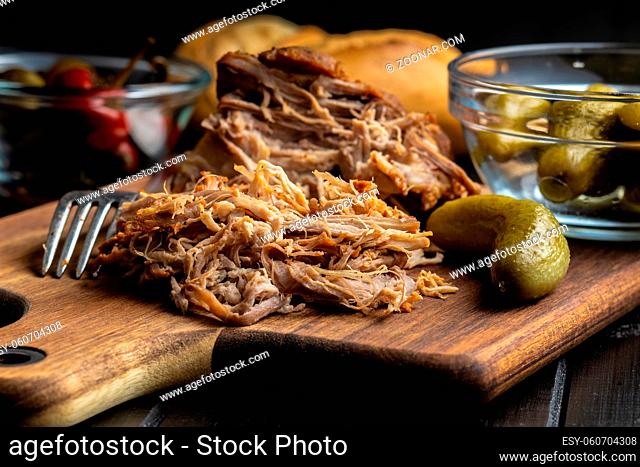 Pulled pork meat on cutting board