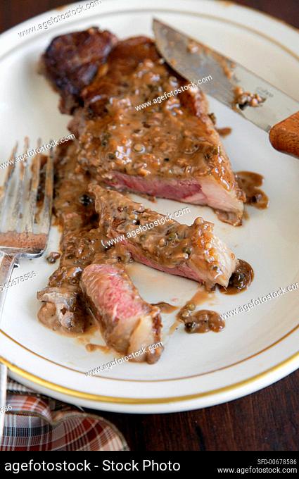 Sliced Strip Steak with Green Peppercorn Sauce