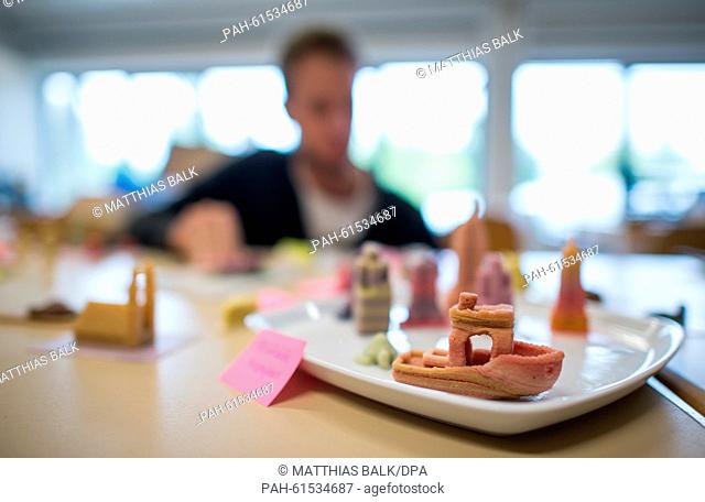 Different 3D printed cookies and sweets on a table, in the rooms of the start up business 'Print2Taste' in Freising, Germany, 10 September 2015