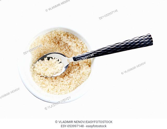 Brown sugar crystals of white background