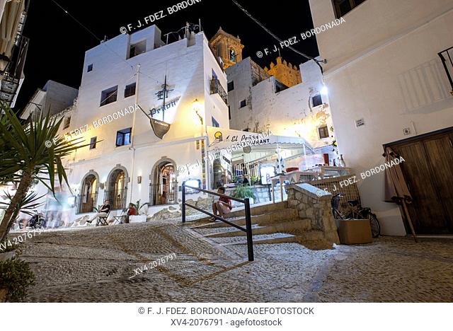 Narrow and white facades of Peñiscola fortified old town, in the night, Castellón, Spain