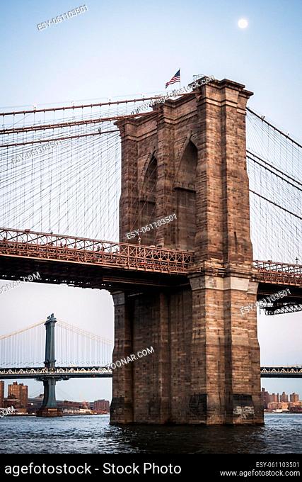 Vertical landscape of Manhattan Bridge and Brooklyn Bridge on the East River in NY