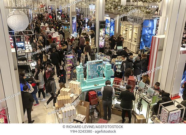 Hordes of shoppers throng the Macy's Herald Square flagship store in New York looking for bargains on the day after Thanksgiving, Black Friday, November 23