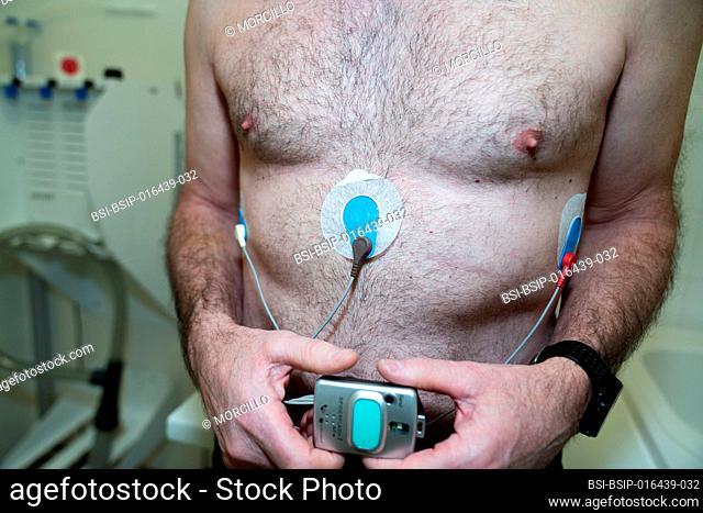 Placement of a holter on a fifty-year-old suffering from cardiac arrhythmia