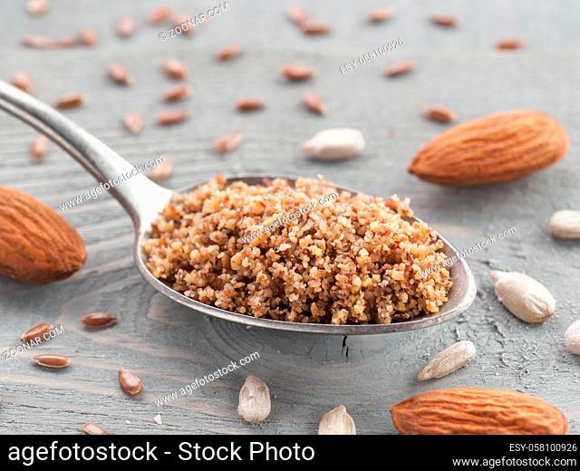Homemade LSA mix in spoon - Linseed or flax seeds, Sunflower seeds and Almonds. Traditional Australian blend of ground, source of dietary fiber, protein