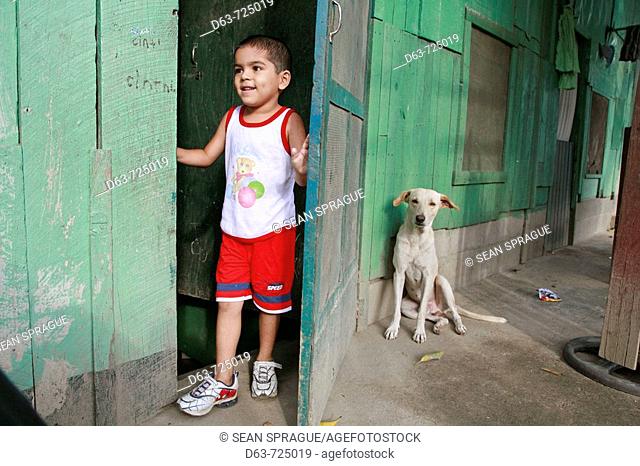 Boy and dog in the slum 'barrio' of Chamelecon, San Pedro Sula, Honduras