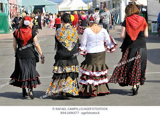 Women with typical dresses at April Fair, Barcelona. Catalonia, Spain