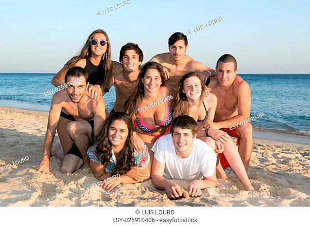Group of happy teenage friends at the beach