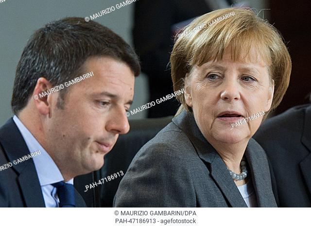 German Chancellor Angela Merkel (CDU, R) and new Italian Prime Minister Matteo Renzi meet with representatives of their governments for a cabinet session in the...