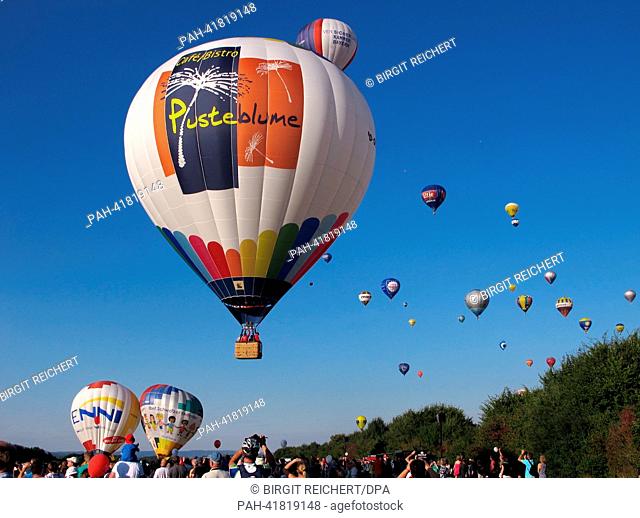 View of a colourful array of ballons in the sky over Germany's Rheinland-Pfalz state during a gathering of 75 hot air balloon teams from seven countries