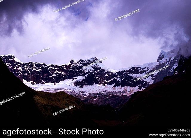 Snow covers the glacier at El Altar Volcano in the Andes near Banos, Ecuador. The Andean landscape near Banos in Ecuador features volcanic glaciers and the...