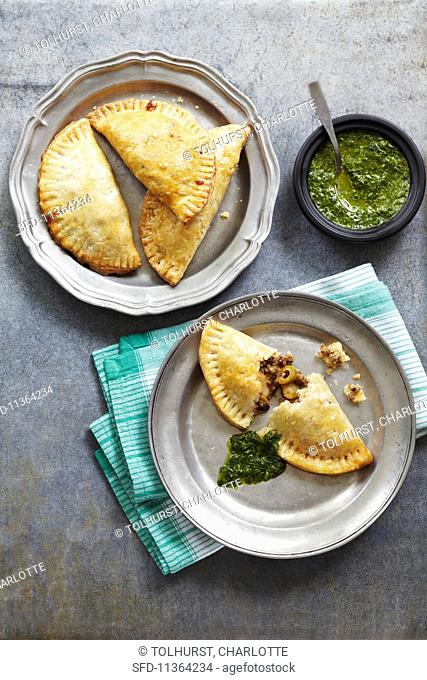 Lamb and olive pasties with spinach pesto