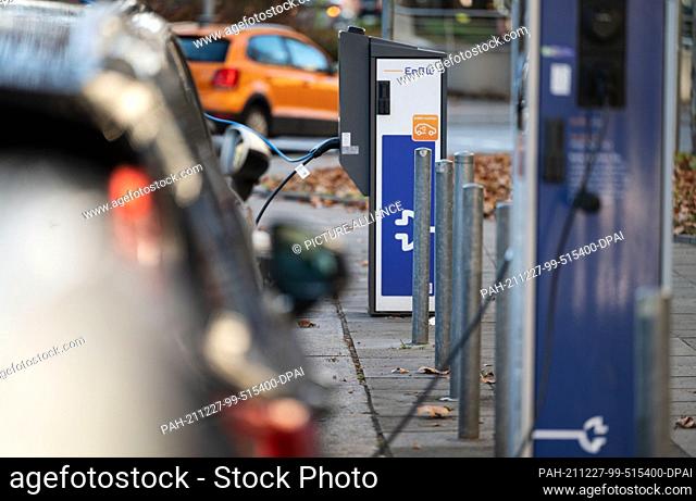 27 December 2021, Baden-Wuerttemberg, Stuttgart: Charging columns of the energy company EnBW are located on a street in the city centre