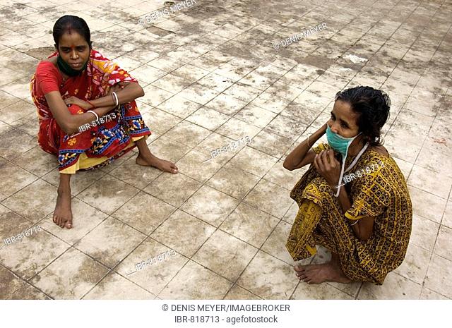 Multi-resistant tuberculosis patients Radha Devi, 30, left, and Najira Begum, 35, sitting on the roof terrace of the quarantine station of a specialized TB...