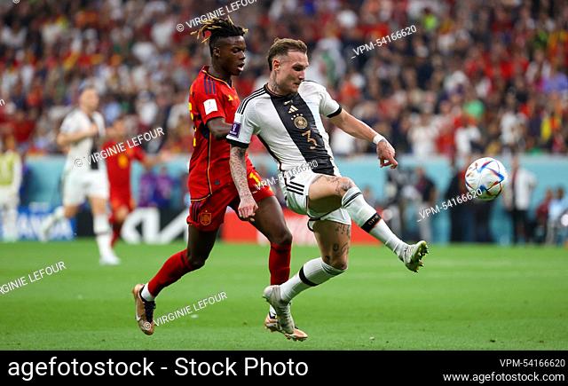 Spain's Nico Williams and German David Raum fight for the ball during a soccer game between Spain and Germany, in Group E of the FIFA 2022 World Cup in Al Bayt...