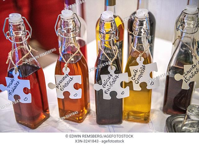 A variety of bottles full of infused spirits, Bialystok, Poland wedding feast