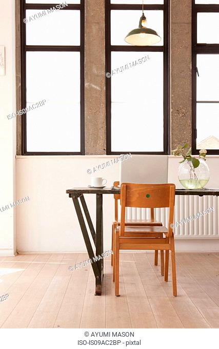 Apartment interior with table and chairs