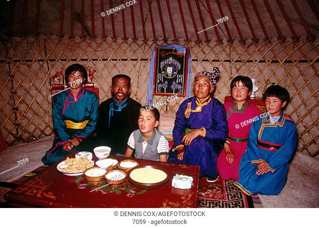 Mongolian family inside yurt. Inner Mongolia. China