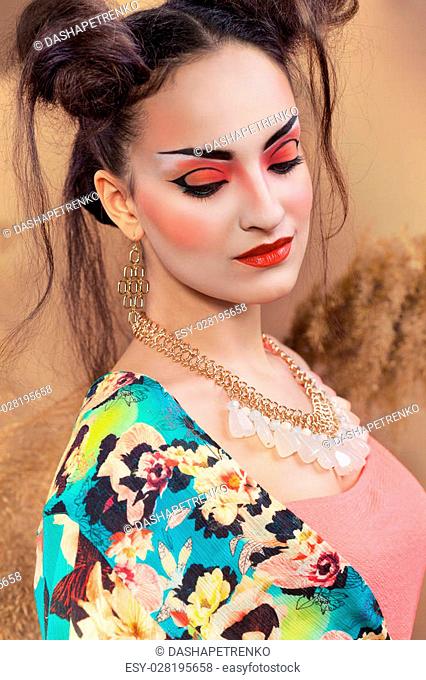 Stylized portrait of a Japanese geisha with bright make up