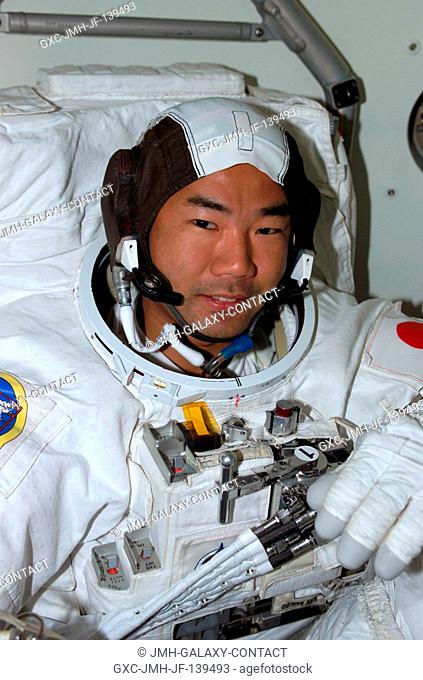 Astronaut Soichi Noguchi, representing the Japan Aerospace Exploration Agency (JAXA), attired in his Extravehicular Mobility Unit (EMU) space suit on the...