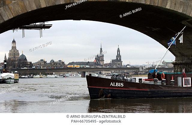 A Czech freighter pictured in front of the pillars of Albert Bridge on the Elbe river in Dresden, Germany, 15 March 2016