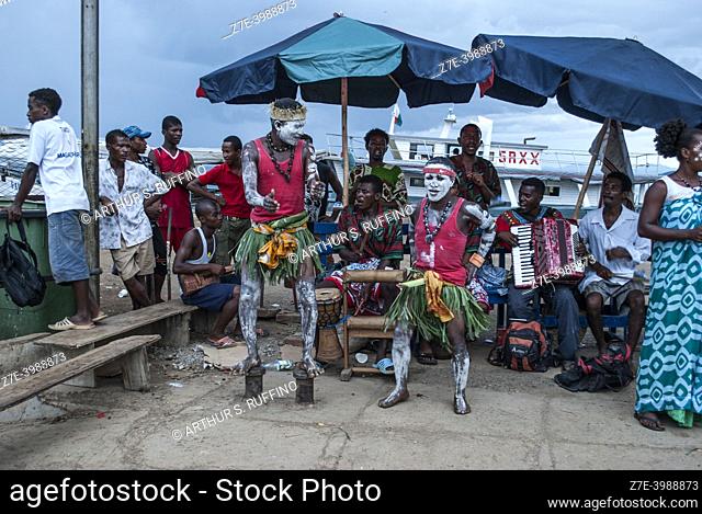 Musical group performs for visitors at pier. Nosy Be, Madagascar